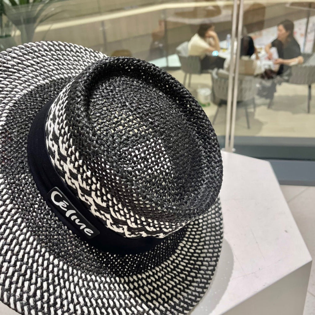 CELINE WIDE BRIM HAT MODEL 652048 IN BLACK AND WHITE WOVEN STRAW