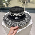 CELINE WIDE BRIM HAT MODEL 652048 IN BLACK AND WHITE WOVEN STRAW