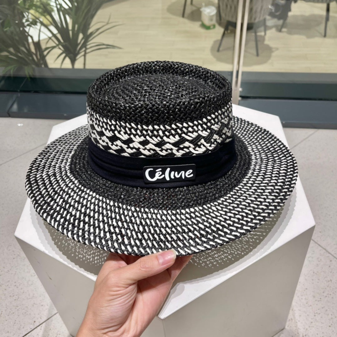 CELINE WIDE BRIM HAT MODEL 652048 IN BLACK AND WHITE WOVEN STRAW