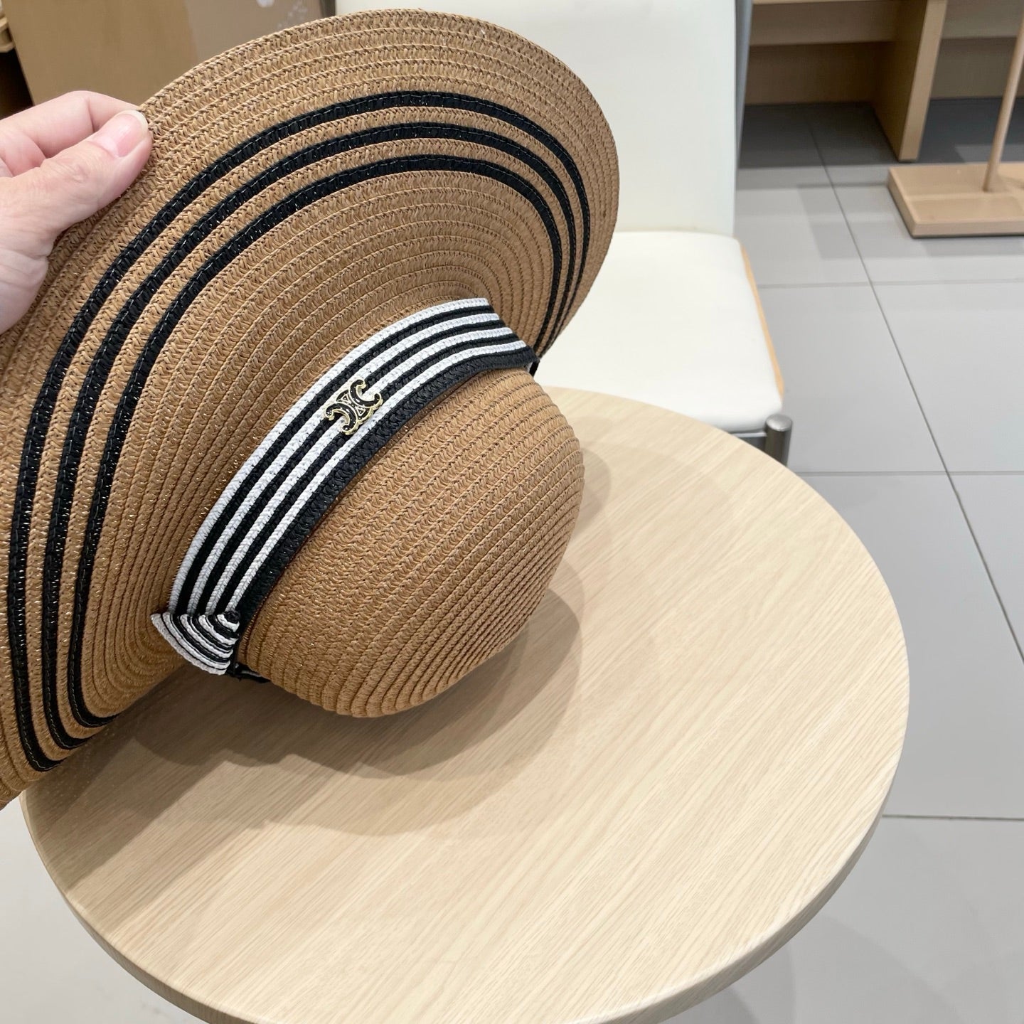 CELINE WIDE BRIM HAT MODEL 650410 IN BROWN WITH BLACK STRIPES WOVEN STRAW