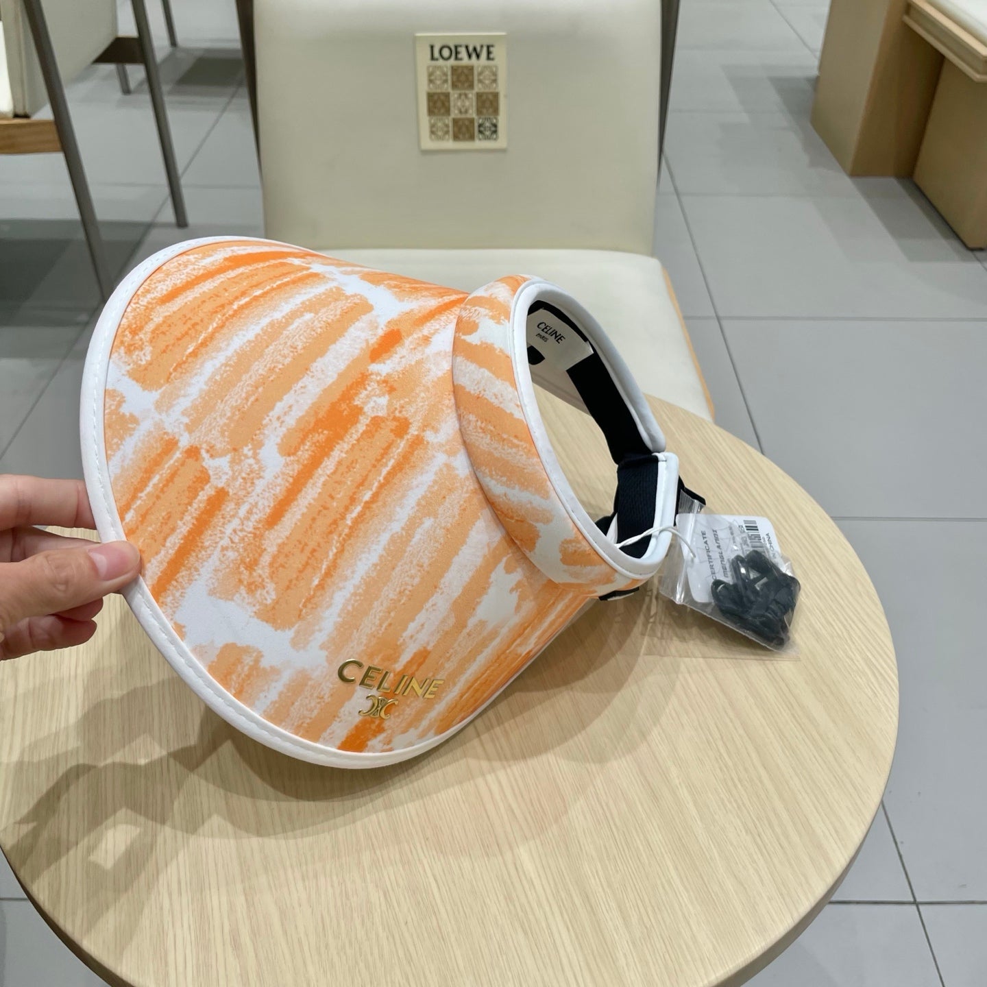 CELINE VISOR HAT MODEL 652202 IN ORANGE AND WHITE FABRIC